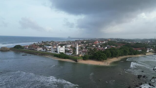 cinematic aerial close-up footage of the famous Galle Fort, an ancient fortress and iconic landmark situated by the Indian Ocean in Galle, Sri Lanka, South Asia. Perfect for travel and historical them
