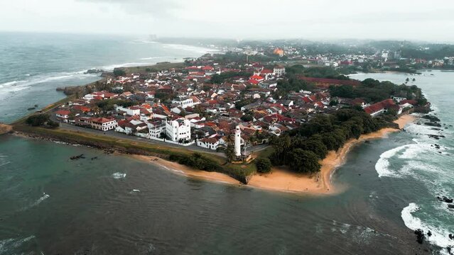 cinematic aerial close up drone footage of the famous Galle Fort, an ancient fortress and iconic landmark situated by the Indian Ocean in Galle, Sri Lanka, South Asia