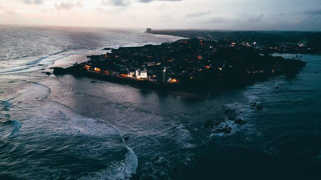 Galle Fort Nighttime Aerial Cinematic Ancient Lighthouse Illuminating Indian Ocean - Galle, Sri Lanka