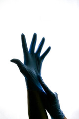 Hands in sterile gloves. Black silhouette hands on white background. Medicine, sterilization, cleanliness. There is room for text. High quality photo