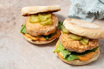 Salmon fishburger english muffin sandwich