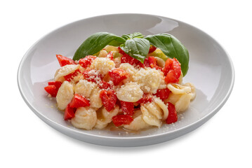 Pasta orecchiette seasoned with fresh tomato, olive oil and with basil leaves and parmisan  in white plate isolated. Typical Italian Apulian recipe
