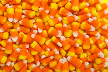 Tasty Halloween candy corns as background, closeup