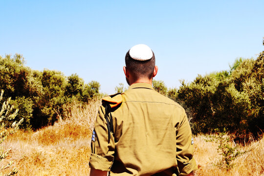 Religious Jewish soldier of the Israel Defense Forces - IDF - Tzahal . Israeli soldier with a kippah on his head with the rank of sergeant