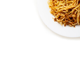 Portion of high quality spaghetti Bolognese on white plate and white background. Premium quality dish made with fine products.
