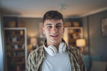 Portrait of teenage boy caucasian teen male young man stand at home