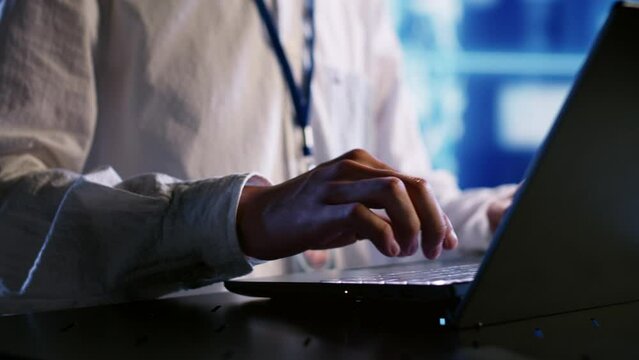 Knowledgeable expert developing artificial intelligence neural networks architecture inspired by human brain. Trained developer setting up AI machine learning algorithms in high tech startup, close up