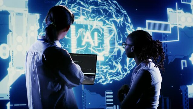 Coworkers deploying lines of code for artificial intelligence computerized model simulating human brain. Colleagues overseeing AI visualization showing machine learning algorithms pattern recognition