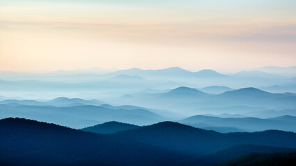 Fototapeta na wymiar Mountains in silhouette with shadows of blue hues