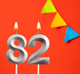 Birthday candle number 82 - Invitation card in orange background