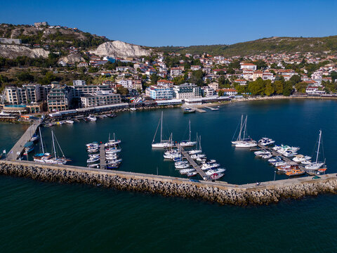 Aerial view of a yacht marina by the sea, adorned with elegant yachts, creating a picturesque maritime scene. Balchik Bulgaria
