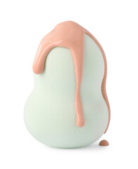 Makeup sponge with skin foundation isolated on white