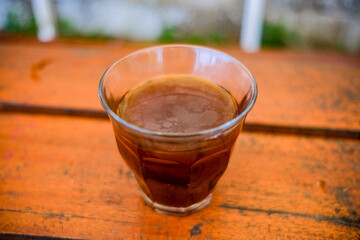 a cup of hot americano coffee