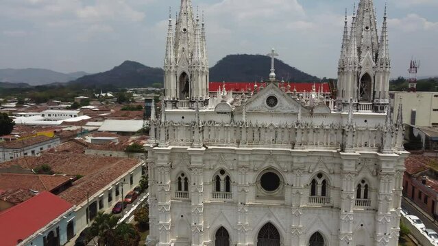 Aerial orbits ornate front facade of gothic Santa Ana Cathedral, SLV