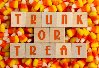 Wooden Trunk or Treat sign with a Background of Classic Candy Corn © pamela_d_mcadams