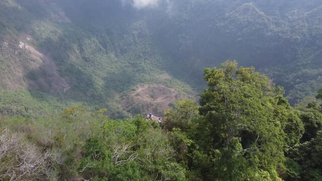 Aerial flyover reveals tourists on rim of San Salvador volcano crater