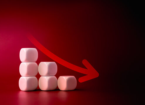 Down arrow on white dice blocks stacked, decrease business graph down step, finance diagram on red background. Financial crisis, bankruptcy, loss investment economic recession sales risk concepts.
