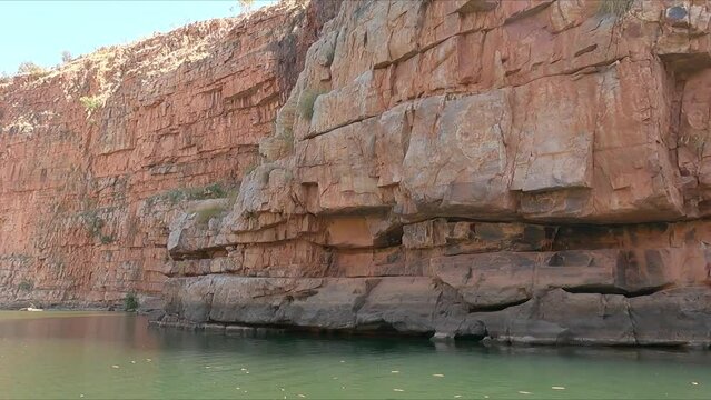 Motoring along gorge and sandstone escarpments in Chamberlain Gorge Western Australia