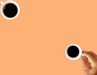 Hand holding a cup of coffee and isolated mug of coffee. Ready template, business presentation. Minimalist background. Copy space.