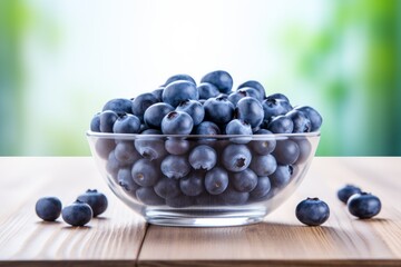 Delicious Blueberry Delight: Bowl of Fresh Blueberries on a White Background with Rustic Wooden Table