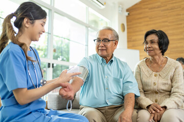 Obraz premium Young asian woman nurse home care checking list health care advice or prescription online on tablet to elderly lady,older people at home.homecare,health care advice,support empathy to elderly at home