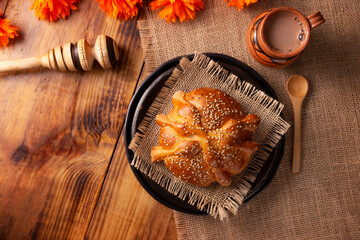 Pan de Muerto. Typical Mexican sweet bread with sesame seeds, that is consumed in the season of the day of the dead. It is a main element in the altars and offerings in the festivity
