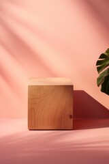 A wooden cube sitting next to a palm tree