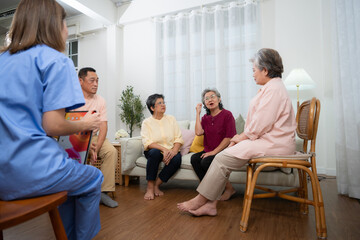 Group of elderly and Asian senior man having a conversation with nurse in the retirement home