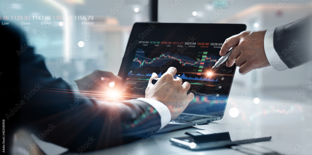 Poster business team working together. businessman using laptop for analyzing data stock market graph with 