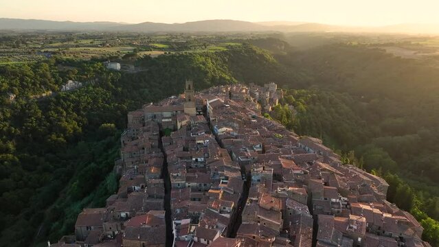 Sunset Aerial View of Medieval Pitigliano Town in Tuscany, Grosseto Province, Italy. Scenic Landscape of Historic Village in Southern Tuscany, push back reveal