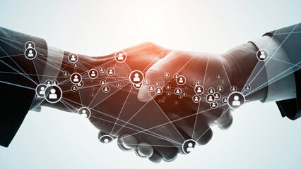 Communication network image with people shaking hands.