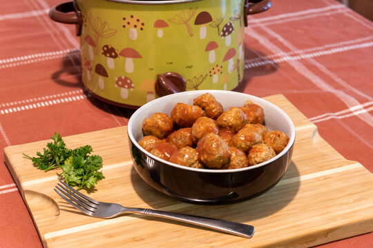 slow cooker crock pot meatballs in bowl on table
