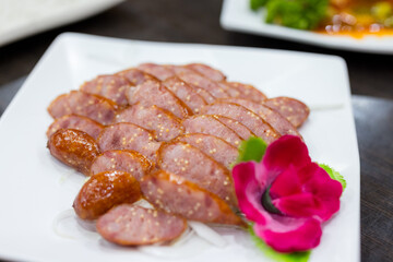 Slice of sausage in plate