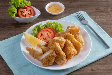 Fried fish on a wooden table