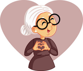 Elderly Senior Woman Making a Heart Gesture with her Hands Vector Cartoon. Old granny making a caring affectionate sign showing love 
