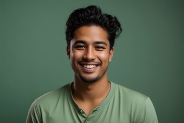 Happy young hispanic man on a solid light green background. Generative ai.