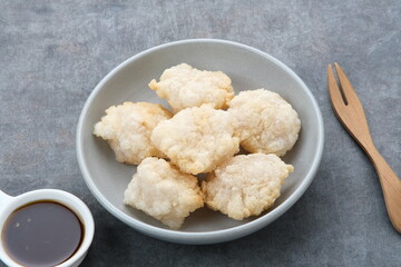 Cireng, a savory snack from West Java, Indonesia, made from tapioca flour and deep-fried, served with a spicy sauce.
