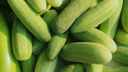 Top view pile of cucumbers textured background