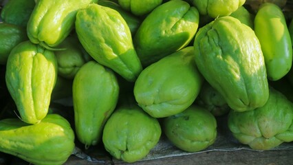 Pile of chayote fruits at the supermarket ready for sale