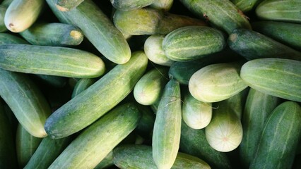 Top view pile of cucumbers textured background