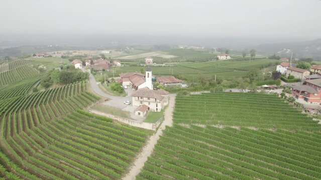Aerial Orbital Shot of Church in Worldwide Famous Barolo Wine Region at Morning, Italy