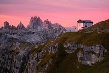Little chapel in mountain at sunrise sunset. Tre chime di Lavaredo in Dolomites. Tyrol. Italy