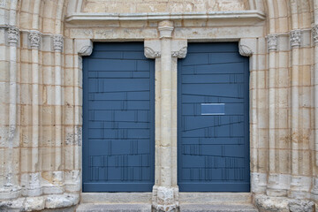 Wooden doors blue on ancient historic building in france europe