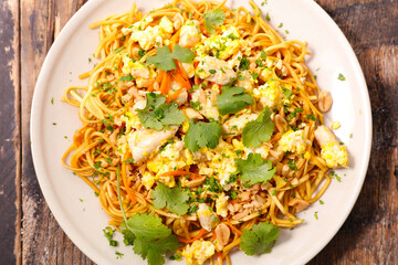 fried noodles with chicken, vegetables and coriander