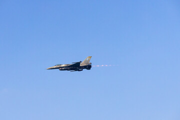 Fighter jet flying in the blue clear sky demonstrating skills_9