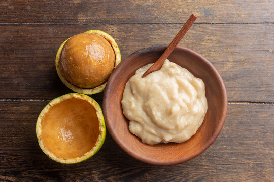 Traditional African cornmeal porridge enriched with Natal orange wild fruit pulp (Strychnos spinosa) served in a bowl