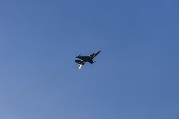 Fighter jet flying in the blue clear sky demonstrating skills_6