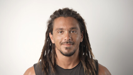 Handsome person look at camera close up. Young adult man face portrait. Stylish 30s guy on isolated white background. Attractive male model. Modern millennial people. Brutal bearded style. Barber shop