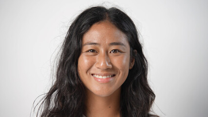 Beautiful person look at camera close up. Young adult woman face portrait. Stylish 30 years old girl on isolated white background. Attractive female feminism model. Modern millennial feminist people.