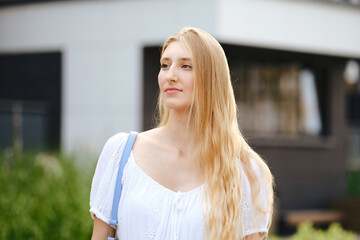 Fototapeta premium Outdoor portrait of young woman